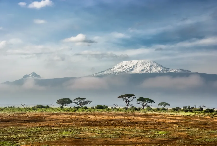 Mount Kilimanjaro snow-capped peak above the Amboseli plains, Tanzania